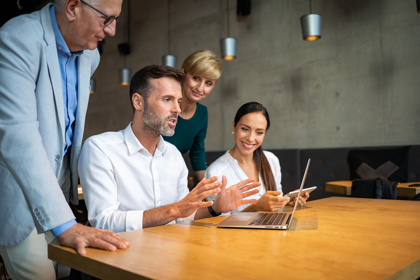 Group of business people with laptop meeting in office