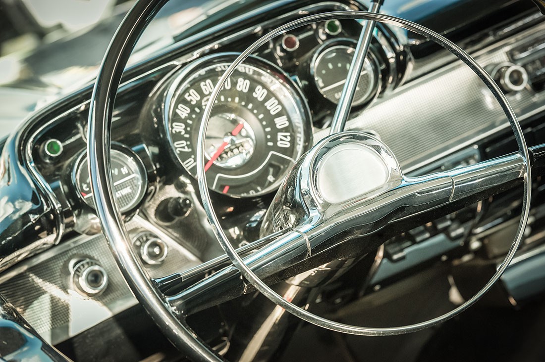 retro styled classic car steering wheel and dashboard dials
